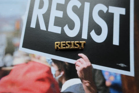 Resist Gold Lapel Pin